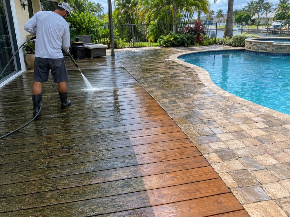 Patio pavers half pressure washed, showing a clear before and after